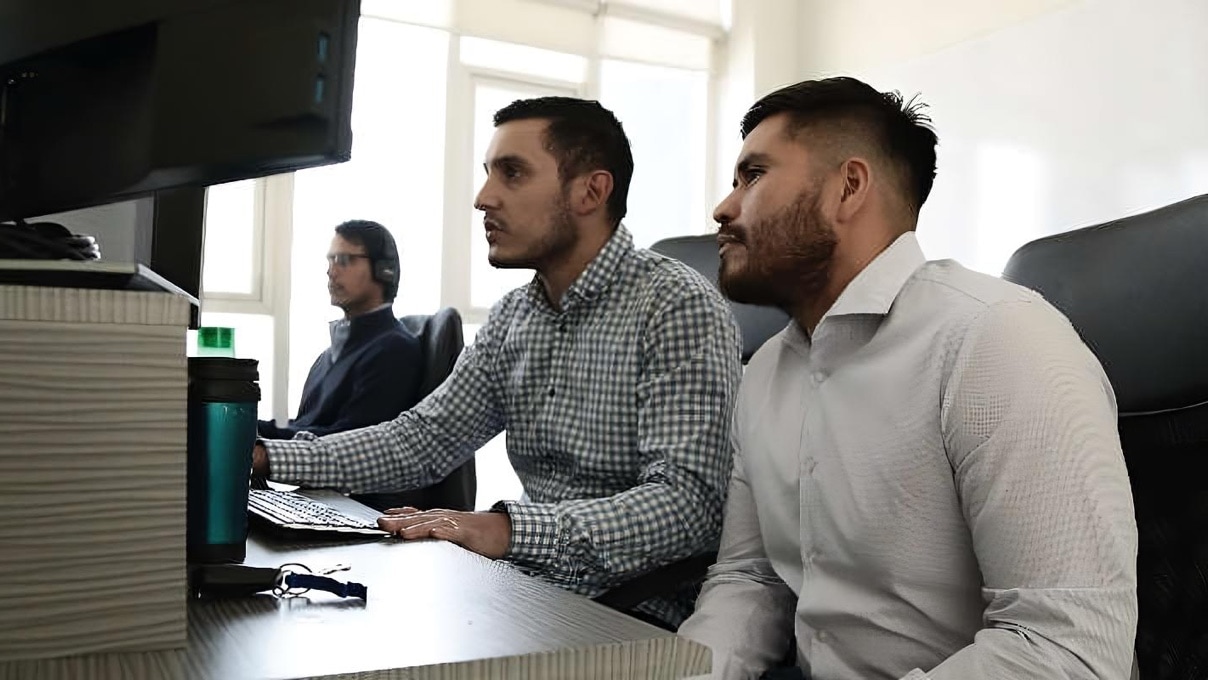 2 young men working on a computer