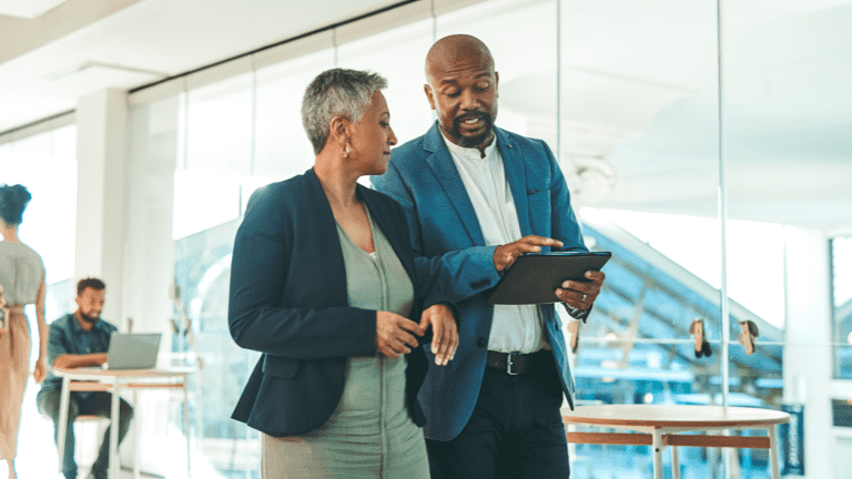 Man and woman meeting with tablet at work