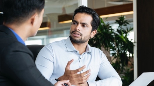 Two men working in an office.