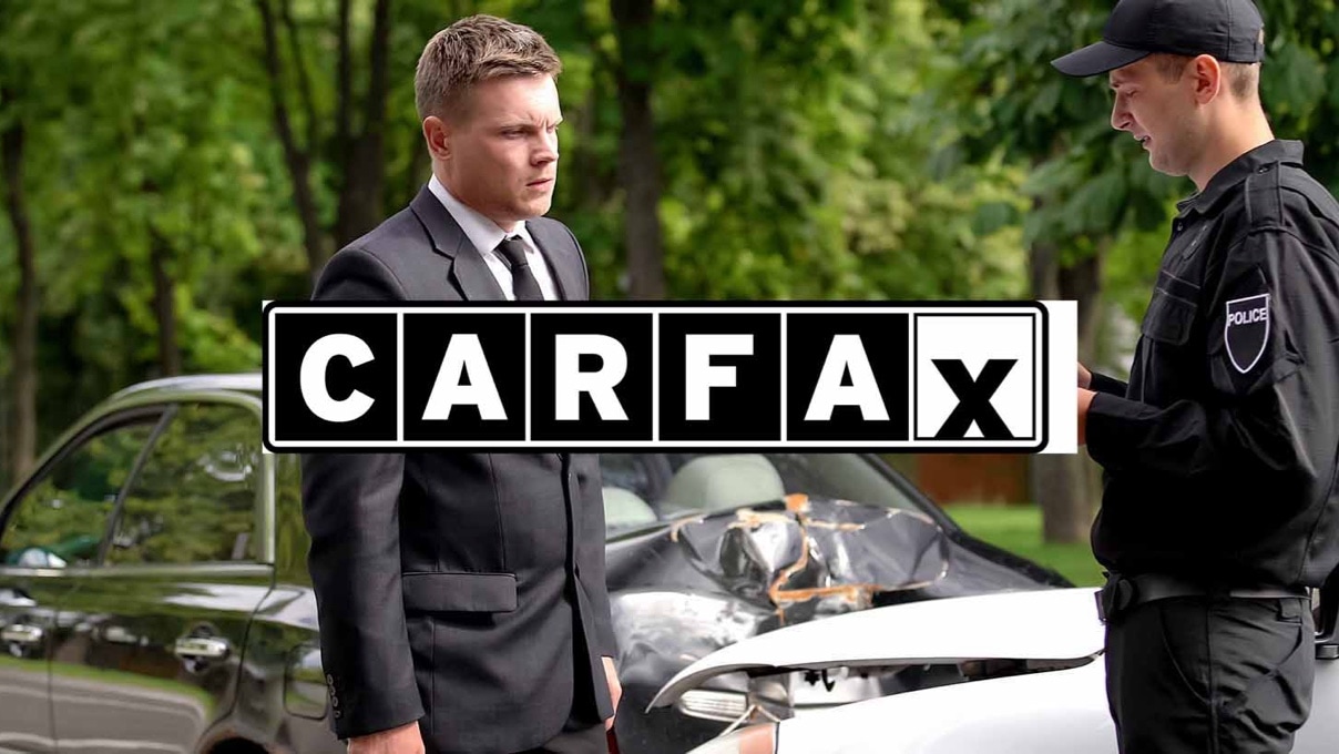 carfax logo over image of a man talking to police after a car crash